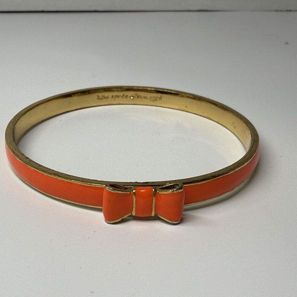 Kate Spade New York Skinny Gold And Orange Enamel Bangle Bow Bracelet - Picture 3 of 8